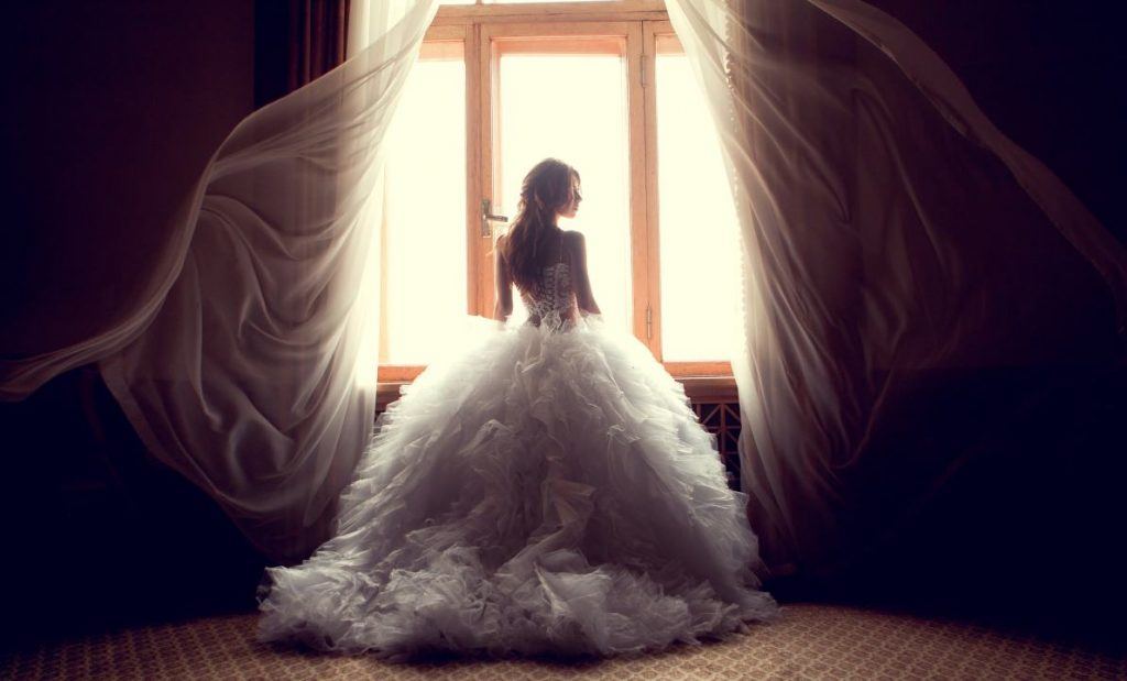 Reverent Wedding Films | bride in the window | wedding videography