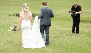 Cameraman videoing couple on wedding day| Reverent Weddings, The Best Wedding Videography